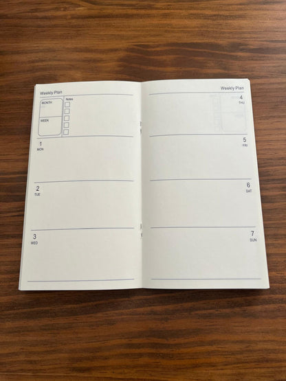 Double page du semainier non daté : une semaine du lundi au dimanche